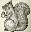 Squirrel. With acorn, facing left. 4.5” x 4”