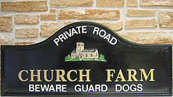 A very attractive Lancaster 3013 displaying the name in gold Times 50mm (2”) lettering, with ‘PRIVATE ROAD’ and ‘BEWARE GUARD DOGS’ in white Helvetica 28mm (approx 1”). The stained glass windows and stone walls of the church is an example of the fine detail you can expect from Hayne-West. Please refer to our emblems to view detail.