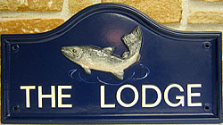 Cast your eye over this beautiful salmon and notice the realistic colouring, which looks perfect against the dark blue background of this Lancaster sign.  The lettering is set out in Helvetica, painted white
