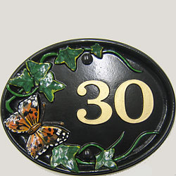 A fine example of a Butterfly Mews number plaque with butterfly and ivy emblem