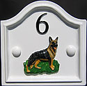 The emblem of the German Shepherd dog, which we made especially to our customer’s own design and colour specification, fits beautifully on our Lancaster Plus number plaque. The black number, which reflects the black hair of the dog, stands out well against the white background. 