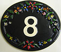 Small but beautiful, our Trinity 2 number plaque has brightly coloured flowers top and bottom