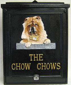 The emblem on this small personalised post box was made especially for a customer from a photograph. The gold Times Condensed lettering, set out in straight lines below it, compliment the colouring and shading of the dog perfectly