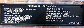 The lettering on this rectangular plaque is set out in Helvetica. The plaque is displayed on the new bandstand at Ross-on-Wye. 